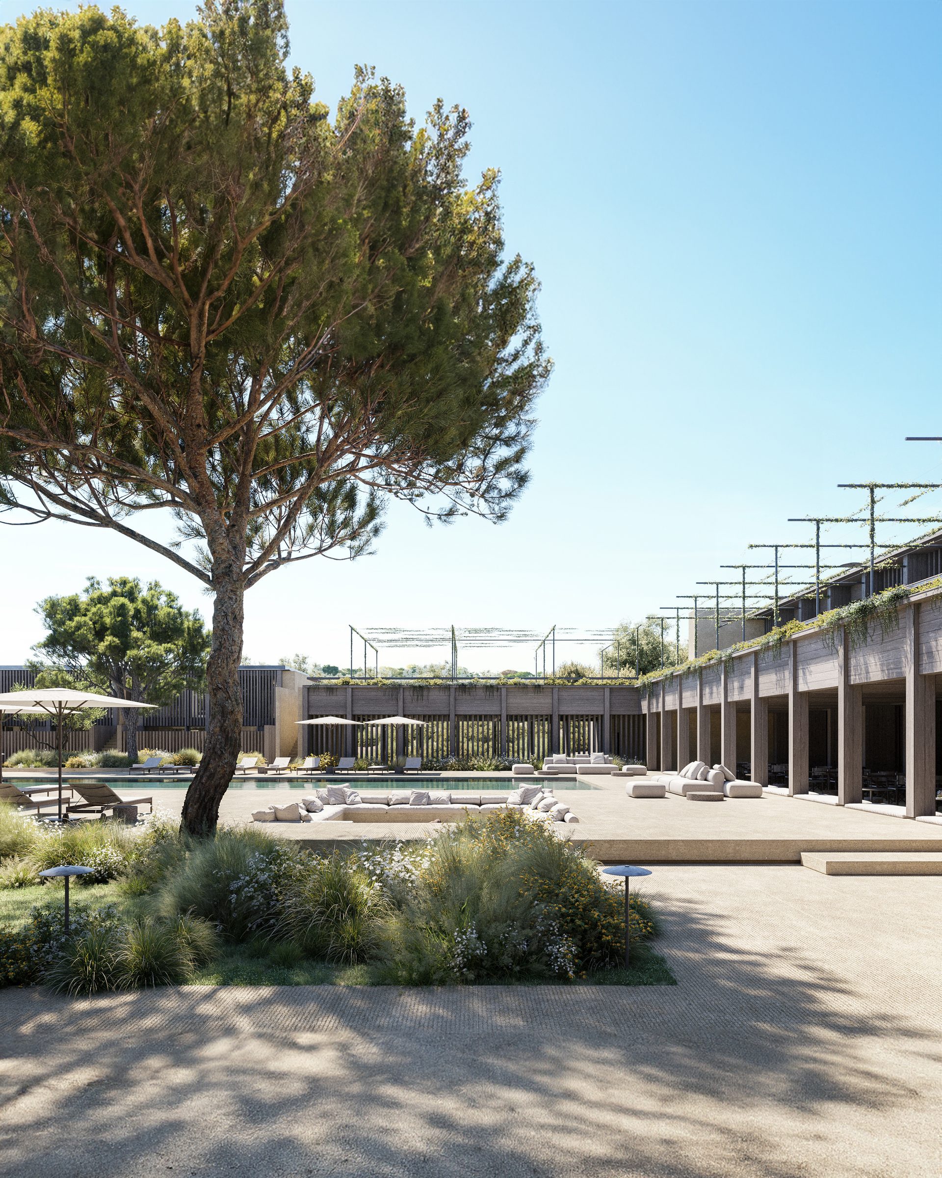 The central pool courtyard of the AMAIA hotel signature building.