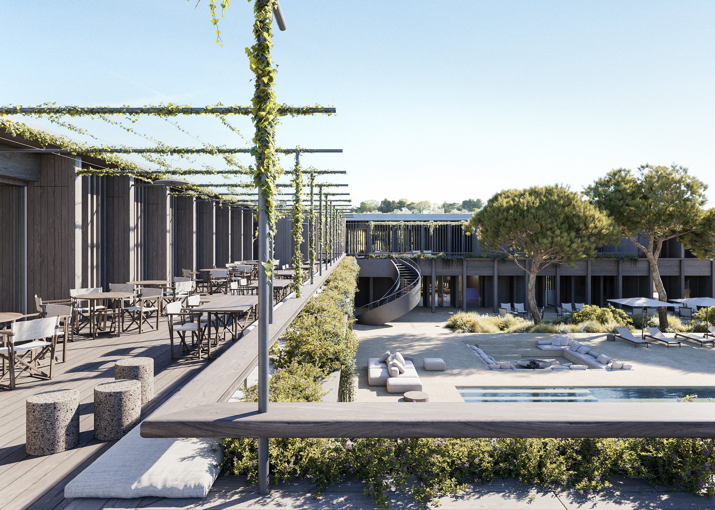 The signature restaurant terrace at the AMAIA hotel, with timber colonnades, vines overhead, and views to the central pool courtyard.