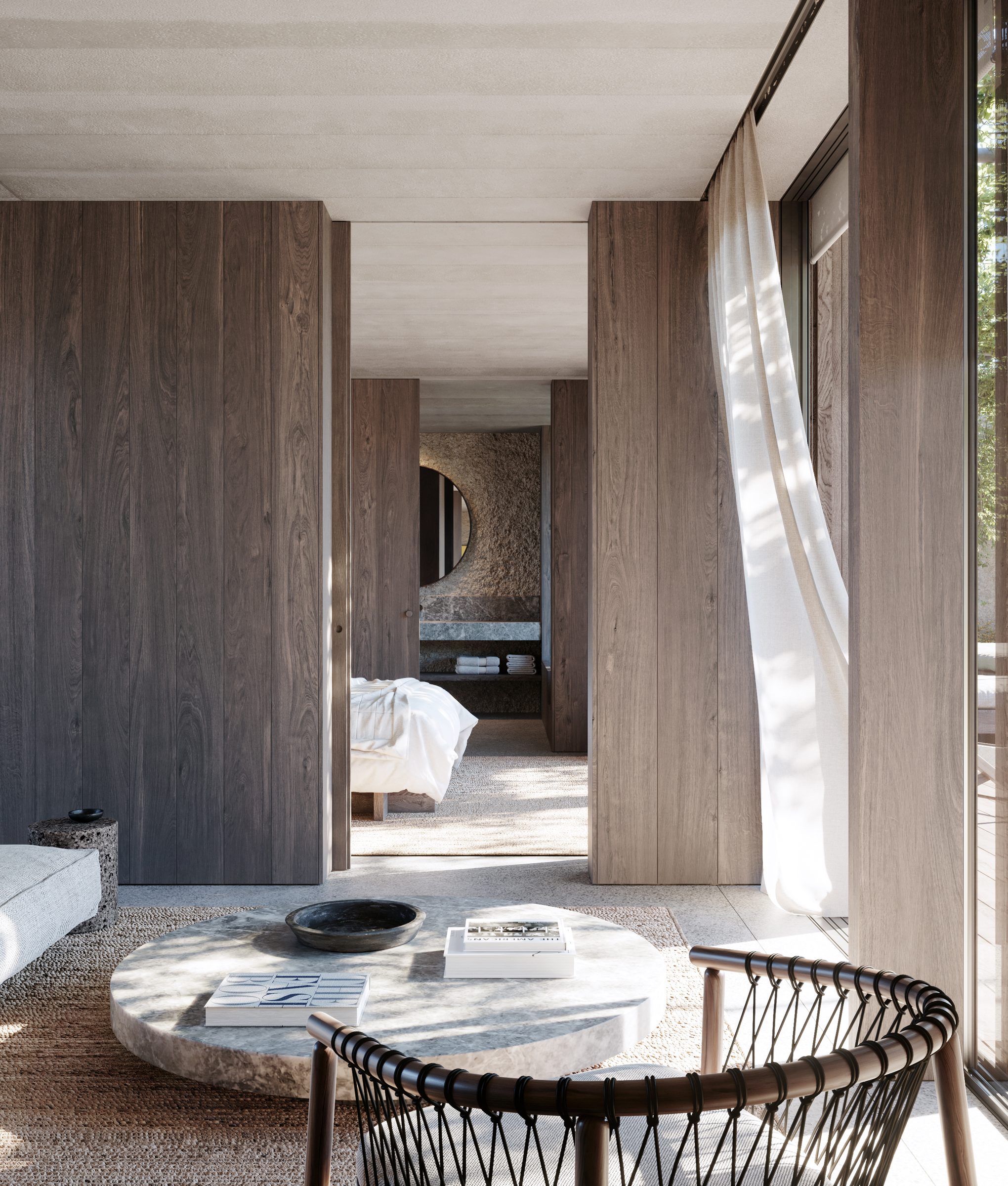 A suite bedroom at the AMAIA hotel, opening onto a private walled courtyard with plunge pool.