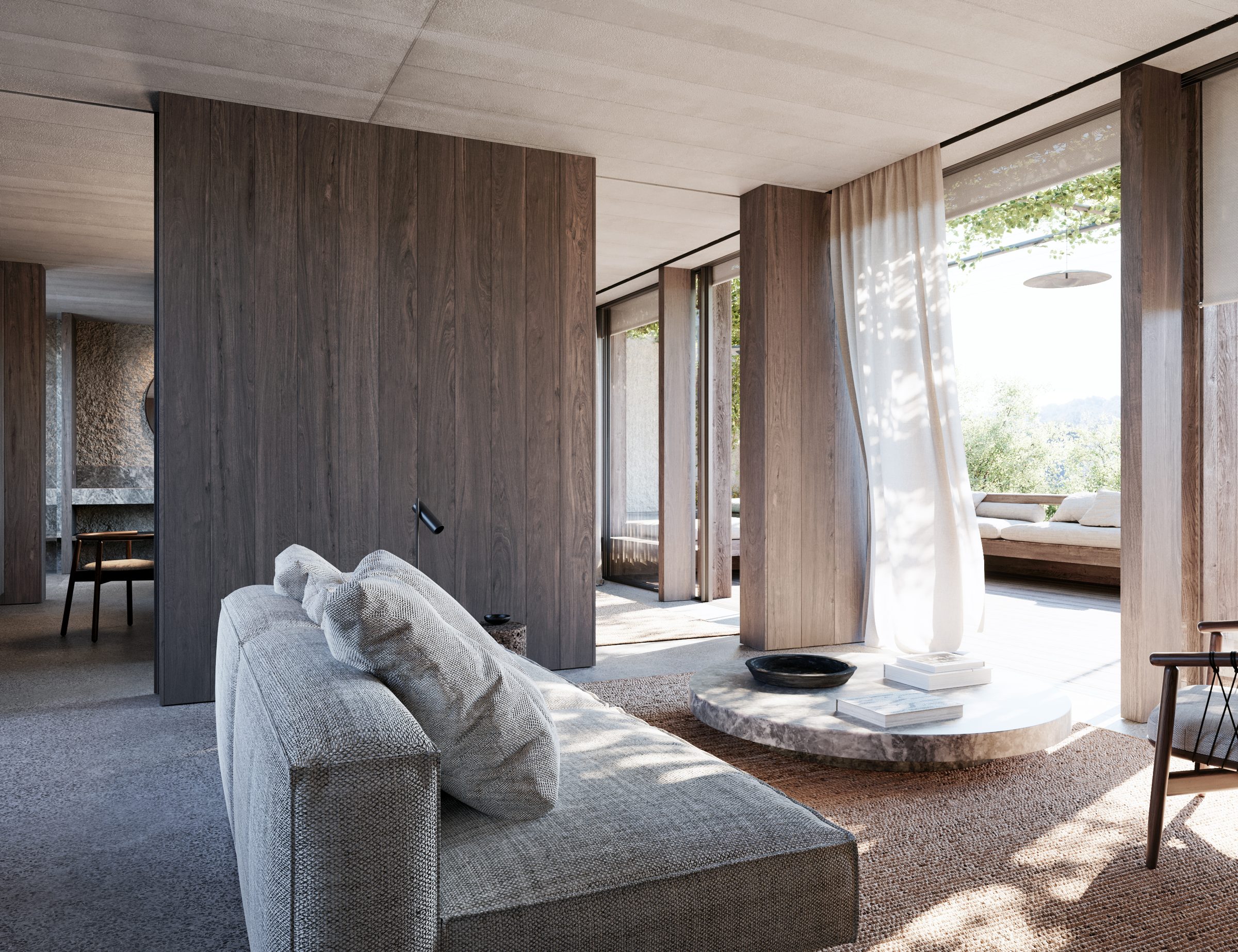 A suite lounge with vertical timber walls, a textured render feature wall, and a low concrete coffee table.
